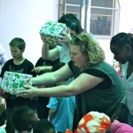 Volunteers hand out gifts